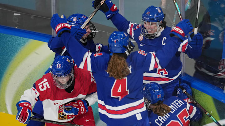 Feb 5, 2026; Milan, Italy; Hilary Knight (21) of Team United States celebrates with Alex Carpenter (25) and other teammates after scoring a goal against Team Czechia in women's ice hockey Group A play during the Milano Cortina 2026 Olympic Winter Games at Milano Rho Ice Hockey Arena. Mandatory Credit: James Lang-Imagn Images