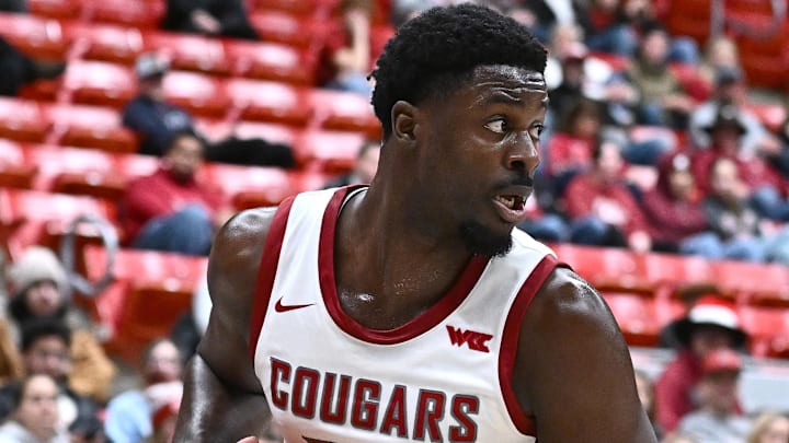 Oct 25, 2025; Pullman, WA, USA; Washington State Cougars forward Nd Okafor (22) rebounds the ball against the New Mexico Lobos  in the first half at Friel Court at Beasley Coliseum. Mandatory Credit: James Snook-Imagn Images