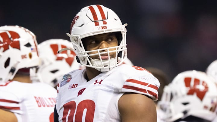 Dec 27, 2022; Phoenix, Arizona, USA; Wisconsin Badgers defensive end James Thompson Jr. (90) against the Oklahoma State Cowboys during the 2022 Guaranteed Rate Bowl at Chase Field. Mandatory Credit: Mark J. Rebilas-Imagn Images Dec 27, 2022; Phoenix, Arizona, USA; Wisconsin Badgers defensive end James Thompson Jr. (90) against the Oklahoma State Cowboys during the 2022 Guaranteed Rate Bowl at Chase Field. Mandatory Credit: Mark J. Rebilas-Imagn Images
