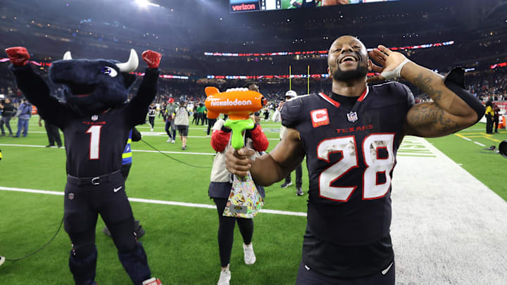 Toro and Joe Mixon celebrate the Texans' 32–12 win over the Chargers in an AFC wild-card game on Jan. 11, 2025.