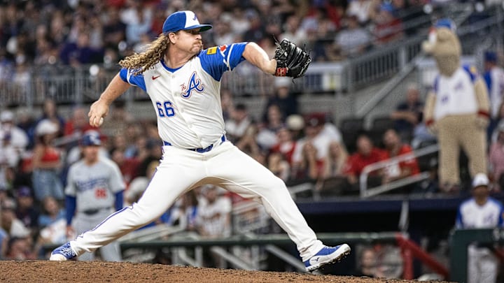 Sep 14, 2024; Cumberland, Georgia, USA; Atlanta Braves pitcher Grant Holmes (66) pitches the ball against the Los Angeles Dodgers during the seventh inning at Truist Park. Mandatory Credit: Jordan Godfree-Imagn Images