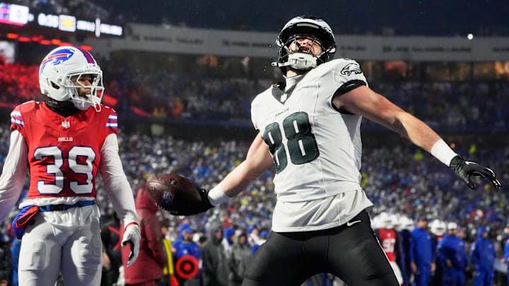 Dec 28, 2025; Orchard Park, New York, USA; Philadelphia Eagles tight end Dallas Goedert (88) reacts after catching a one-yard touchdown thrown by quarterback Jalen Hurts (not pictured) against Buffalo Bills cornerback Cam Lewis (39) during the first quarter at Highmark Stadium. Mandatory Credit: Gregory Fisher-Imagn Images