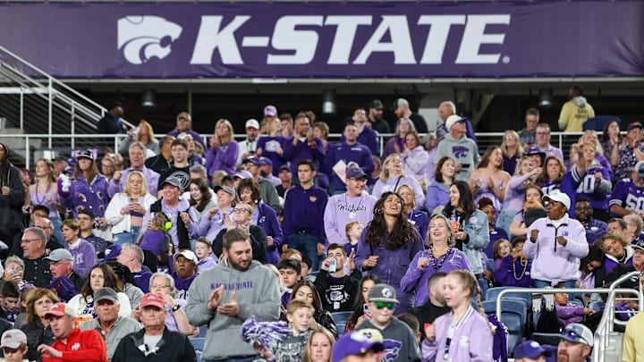 Dec 28, 2023; Orlando, FL, USA;  Kansas State Wildcats fans cheer during the Pop-Tarts bowl against the North Carolina State Wolfpack at Camping World Stadium. Mandatory Credit: Nathan Ray Seebeck-USA TODAY Sports