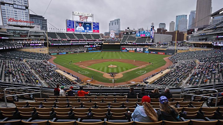 Jun 26, 2025; Minneapolis, Minnesota, USA; Sparsely seated fans watch the Seattle Mariners play the Minnesota Twins in the seventh inning after a nearly four and a half hour rain delay at Target Field. Jun 26, 2025; Minneapolis, Minnesota, USA; Sparsely seated fans watch the Seattle Mariners play the Minnesota Twins in the seventh inning after a nearly four and a half hour rain delay at Target Field.