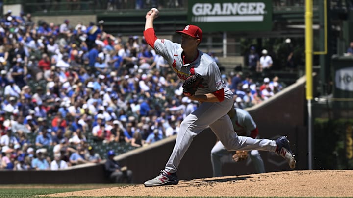 Jun 14, 2024; Chicago, Illinois, USA; St. Louis Cardinals pitcher Kyle Gibson delivers during the first inning against the Chicago Cubs at Wrigley Field. Jun 14, 2024; Chicago, Illinois, USA; St. Louis Cardinals pitcher Kyle Gibson delivers during the first inning against the Chicago Cubs at Wrigley Field.