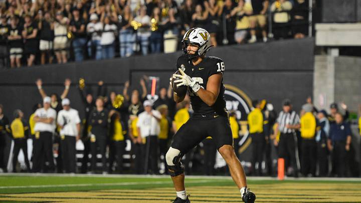 Nov 8, 2025; Nashville, Tennessee, USA;  Vanderbilt Commodores tight end Cole Spence (16) scores what becomes the game winning touchdown against the Auburn Tigers during the overtime period at FirstBank Stadium. Mandatory Credit: Steve Roberts-Imagn Images