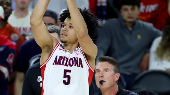 Apr 4, 2026; Indianapolis, IN, USA; Arizona Wildcats guard Brayden Burries (5) attempts a three-pointer against the Michigan Wolverines in the second half during a semifinal of the Final Four of the men's 2026 NCAA Tournament at Lucas Oil Stadium. Mandatory Credit: Trevor Ruszkowski-Imagn Images