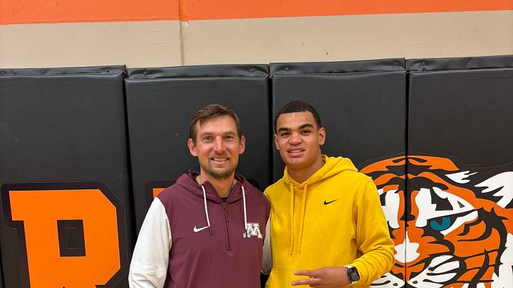 Gophers' Director of Recruiting John Schaekel with Isaiah Asuma. Gophers' Director of Recruiting John Schaekel with Isaiah Asuma.