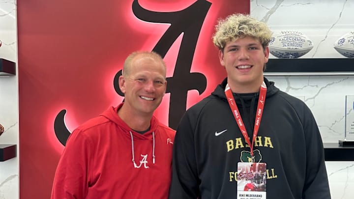 2027 OT Jake Hildebrand alongside Kalen DeBoer 2027 OT Jake Hildebrand alongside Kalen DeBoer