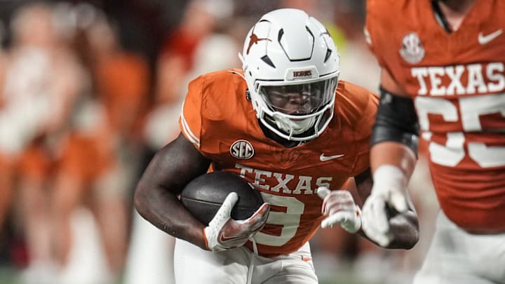 Texas Longhorns running back Jerrick Gibson (9) runs the ball forward as the Texas Longhorns take on ULM at Darrell K Royal-Texas Memorial Stadium in Austin Saturday, Sept. 21, 2024.