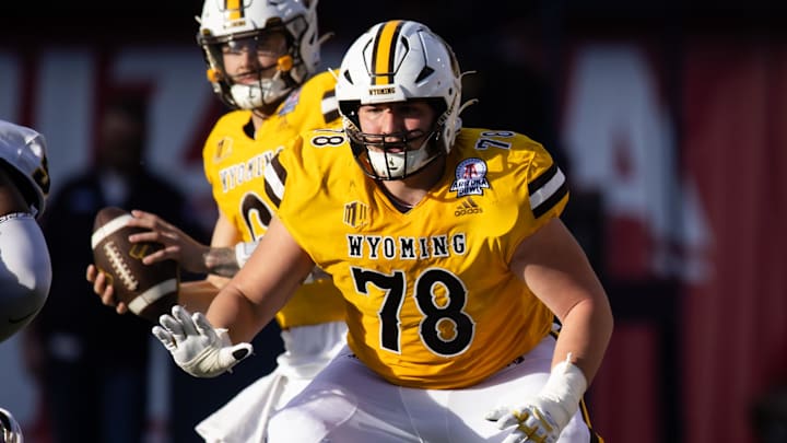 Dec 30, 2023; Tucson, AZ, USA; Wyoming Cowboys guard Wes King (78) against the Toledo Rockets during the Arizona Bowl at Arizona Stadium. Mandatory Credit: Mark J. Rebilas-USA TODAY Sports Dec 30, 2023; Tucson, AZ, USA; Wyoming Cowboys guard Wes King (78) against the Toledo Rockets during the Arizona Bowl at Arizona Stadium. Mandatory Credit: Mark J. Rebilas-USA TODAY Sports