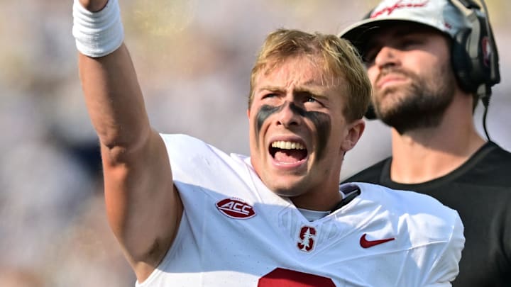 Oct 12, 2024; South Bend, Indiana, USA; Stanford Cardinal quarterback Justin Lamson (8) signals for a first down as he watches a replay on the video board in the first quarter against the Notre Dame Fighting Irish at Notre Dame Stadium. Mandatory Credit: Matt Cashore-Imagn Images