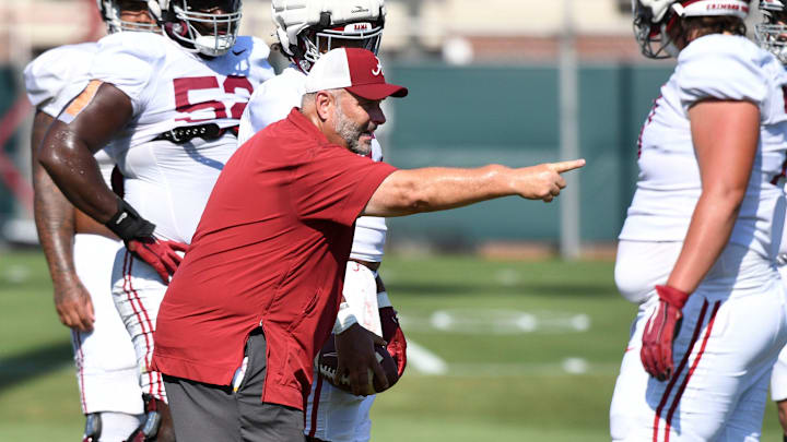 The Crimson Tide players and coaches continue working toward the season opener in practice Tuesday, Aug. 13, 2024. Alabama offensive line coach Chris Kapilovic directs his linemen.