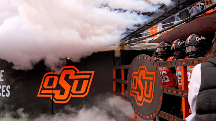 Oklahoma State waits to run on to the field before the college football game between the Oklahoma State Cowboys and the Iowa State Cyclones at Boone Pickens Stadium in Stillwater, Okla., Saturday Nov. 29, 2025. Oklahoma State waits to run on to the field before the college football game between the Oklahoma State Cowboys and the Iowa State Cyclones at Boone Pickens Stadium in Stillwater, Okla., Saturday Nov. 29, 2025.