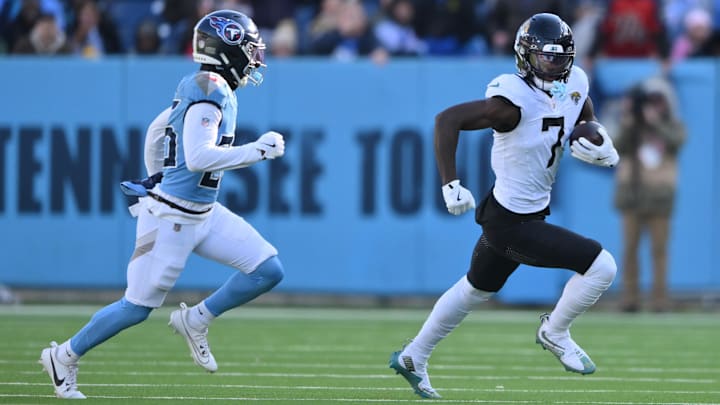 Nov 30, 2025; Nashville, Tennessee, USA; Jacksonville Jaguars wide receiver Brian Thomas Jr. (7) runs after the catch as Tennessee Titans cornerback Marcus Harris (26) defends during the second half at Nissan Stadium. Mandatory Credit: Steve Roberts-Imagn Images Nov 30, 2025; Nashville, Tennessee, USA; Jacksonville Jaguars wide receiver Brian Thomas Jr. (7) runs after the catch as Tennessee Titans cornerback Marcus Harris (26) defends during the second half at Nissan Stadium. Mandatory Credit: Steve Roberts-Imagn Images
