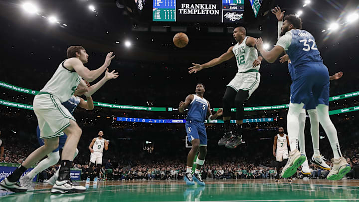 Jan 10, 2024; Boston, Massachusetts, USA: Boston Celtics center Al Horford (42) passes off to center Luke Kornet (40) during the first half against the Minnesota Timberwolves at TD Garden. Mandatory Credit: Winslow Townson-Imagn Images