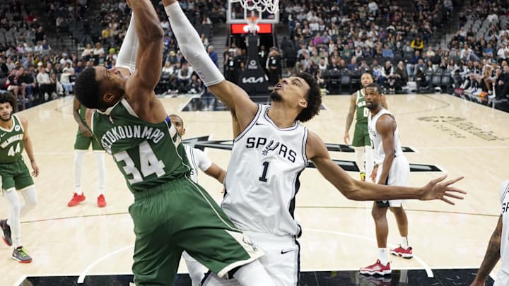 Jan 31, 2025; San Antonio, Texas, USA; Milwaukee Bucks forward Giannis Antetokounmpo (34) goes up for a shot while defended by San Antonio Spurs center Victor Wembanyama (1) during the first half at Frost Bank Center. Mandatory Credit: Scott Wachter-Imagn Images