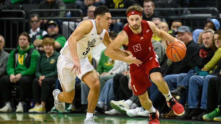 Nebraska guard Sam Hoiberg drives to the basket against Oregon guard Jackson Shelstad.