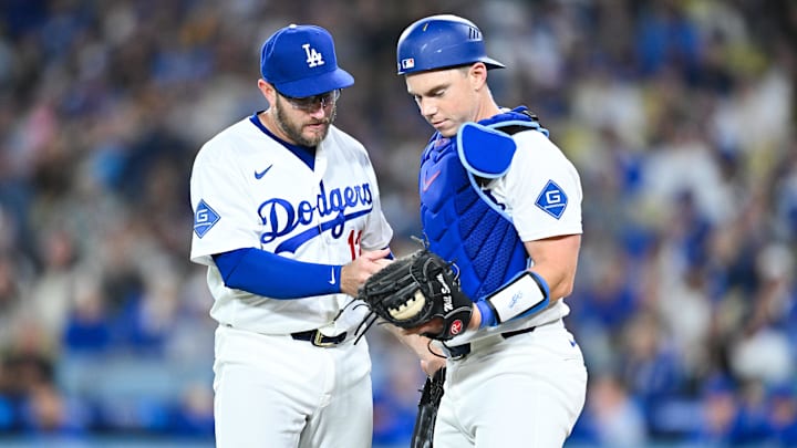 Apr 24, 2026; Los Angeles, California, USA; Los Angeles Dodgers third baseman Max Muncy (13) and Los Angeles Dodgers catcher Will Smith (16) react after colliding during the fourth inning against the Chicago Cubs at Dodger Stadium. Mandatory Credit: William Liang-Imagn Images