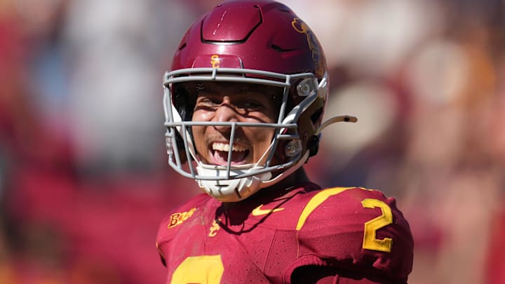 Sep 28, 2024; Los Angeles, California, USA; Southern California Trojans wide receiver Duce Robinson (2) celebrates after scoring on an 8-yard touchdown reception against the Wisconsin Badgersin the second half at United Airlines Field at Los Angeles Memorial Coliseum. Mandatory Credit: Kirby Lee-Imagn Images