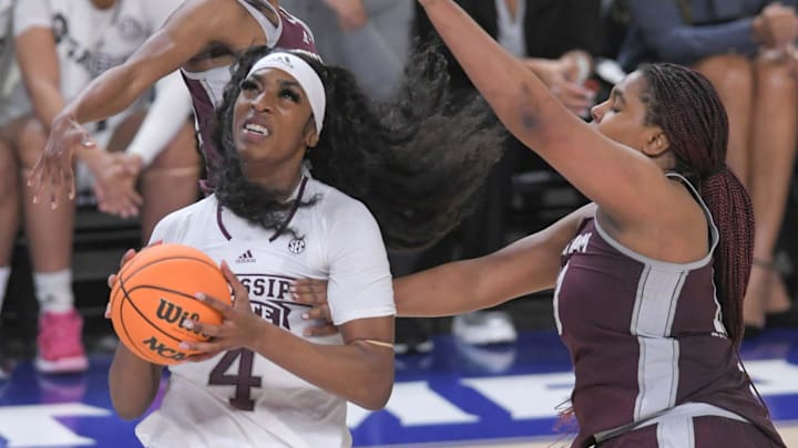 Mississippi State forward Jessika Carter (4) scores near Texas A&M forward Jada Malone (13)