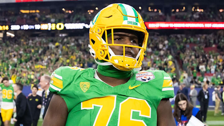 Jan 1, 2024; Glendale, AZ, USA; Oregon Ducks offensive lineman Josh Conerly Jr. (76) against the Liberty Flames during the 2024 Fiesta Bowl at State Farm Stadium. Mandatory Credit: Mark J. Rebilas-Imagn Images