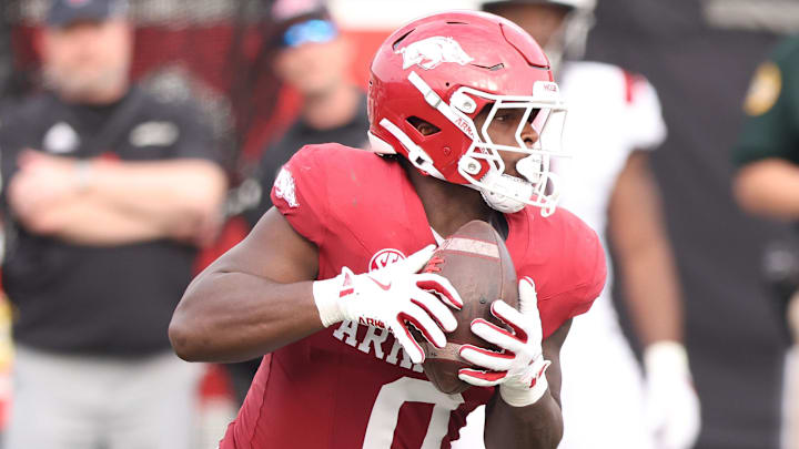 Arkansas Razorbacks running back Braylen Russell (0) rushes against the Arkansas State Red Wolves during the second quarter at War Memorial Stadium.