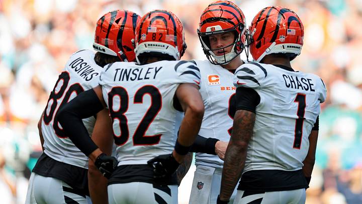 Dec 21, 2025; Miami Gardens, Florida, USA; Cincinnati Bengals quarterback Joe Burrow (9) talks to his teammates Cincinnati Bengals tight end Mike Gesicki (88), Cincinnati Bengals wide receiver Mitchell Tinsley (82) and Cincinnati Bengals wide receiver Ja'Marr Chase (1) after a play during the second quarter against the Miami Dolphins at Hard Rock Stadium. Mandatory Credit: Sam Navarro-Imagn Images Dec 21, 2025; Miami Gardens, Florida, USA; Cincinnati Bengals quarterback Joe Burrow (9) talks to his teammates Cincinnati Bengals tight end Mike Gesicki (88), Cincinnati Bengals wide receiver Mitchell Tinsley (82) and Cincinnati Bengals wide receiver Ja'Marr Chase (1) after a play during the second quarter against the Miami Dolphins at Hard Rock Stadium. Mandatory Credit: Sam Navarro-Imagn Images