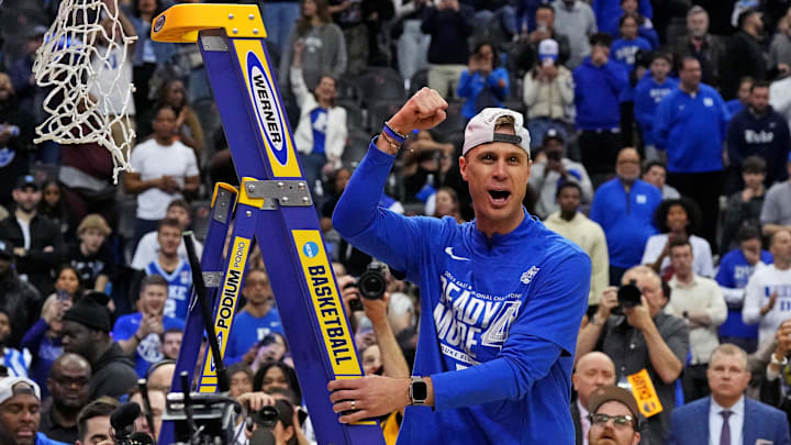 Mar 29, 2025; Newark, NJ, USA; Duke Blue Devils head coach Jon Scheyer cuts down the net after the Duke Blue Devils beat the Alabama Crimson Tide in the East Regional final.