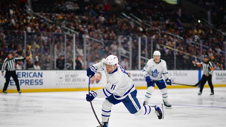 Apr 4, 2026; Los Angeles, California, USA; Toronto Maple Leafs center Max Domi (11) shoots on goal against the Los Angeles Kings during the third period at Crypto.com Arena. Mandatory Credit: Gary A. Vasquez-Imagn Images