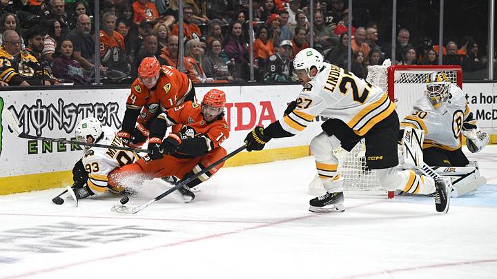 Oct 16, 2026; Anaheim, California, USA; Boston Bruins defense Hampus Lindholm (27) reaches for the puck agaisnt Anaheim Ducks left wing Nikita Nesterenko (13) at Honda Center. Mandatory Credit: Griffin Hooper-Imagn Images Oct 16, 2026; Anaheim, California, USA; Boston Bruins defense Hampus Lindholm (27) reaches for the puck agaisnt Anaheim Ducks left wing Nikita Nesterenko (13) at Honda Center. Mandatory Credit: Griffin Hooper-Imagn Images