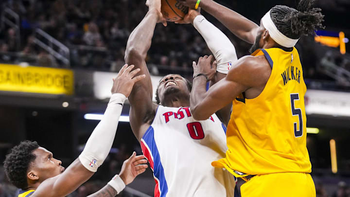 Nov 29, 2024; Indianapolis, IN, USA; Detroit Pistons center Jalen Duren (0) goes up for a shot against Indiana Pacers guard Bennedict Mathurin (00) and Indiana Pacers forward Jarace Walker (5) on Friday, Nov. 29, 2024, during a game between the Indiana Pacers and the Detroit Pistons at Gainbridge Fieldhouse in Indianapolis. The Pistons defeated the Pacers, 130-106. Mandatory Credit: Grace Smith/USA TODAY Network via Imagn Images 