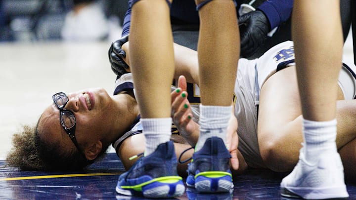Notre Dame guard Olivia Miles winces in pain after taking a fall during the first round of the NCAA Women's Basketball Tournament between Notre Dame and Stephen F. Austin at Purcell Pavilion on Friday, March 21, 2025, in South Bend.
