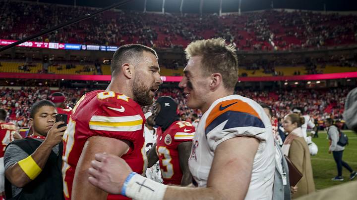 Dec 25, 2025; Kansas City, Missouri, USA; Denver Broncos quarterback Bo Nix (10) and Kansas City Chiefs tight end Travis Kelce (87) after the game at GEHA Field at Arrowhead Stadium. Mandatory Credit: Denny Medley-Imagn Images
