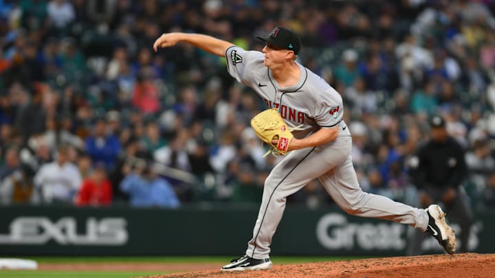 Apr 26, 2024; Seattle, Washington, USA; Arizona Diamondbacks relief pitcher Scott McGough (30) pitches to the Seattle Mariners during the sixth inning at T-Mobile Park. Mandatory Credit: Steven Bisig-Imagn Images Apr 26, 2024; Seattle, Washington, USA; Arizona Diamondbacks relief pitcher Scott McGough (30) pitches to the Seattle Mariners during the sixth inning at T-Mobile Park. Mandatory Credit: Steven Bisig-Imagn Images