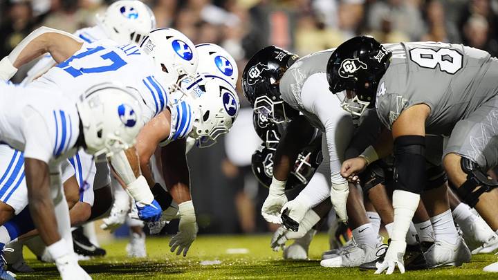 Sep 27, 2025; Boulder, Colorado, USA; Members of the Brigham Young Cougars against the Colorado Buffaloes during the first quarter at Folsom Field. Mandatory Credit: Ron Chenoy-Imagn Images