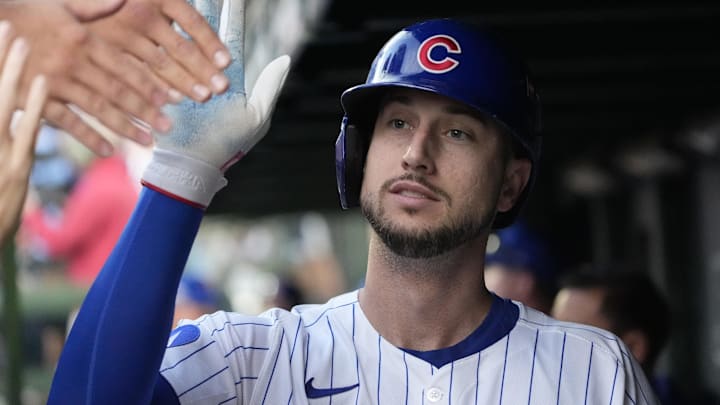 Oct 2, 2025; Chicago, Illinois, USA; Chicago Cubs outfielder Kyle Tucker (30) is greeted in the dugout after scoring against the San Diego Padres during game three of the Wildcard round for the 2025 MLB playoffs at Wrigley Field. Mandatory Credit: David Banks-Imagn Images