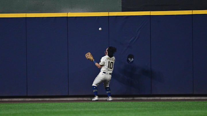 Oct 13, 2025; Milwaukee, Wisconsin, USA; Milwaukee Brewers center fielder Sal Frelick (10) fields a ball off the wall hit by Los Angeles Dodgers third baseman Max Muncy (13) during the fourth inning during game one of the NLCS round for the 2025 MLB playoffs at American Family Field. Mandatory Credit: Benny Sieu-Imagn Images