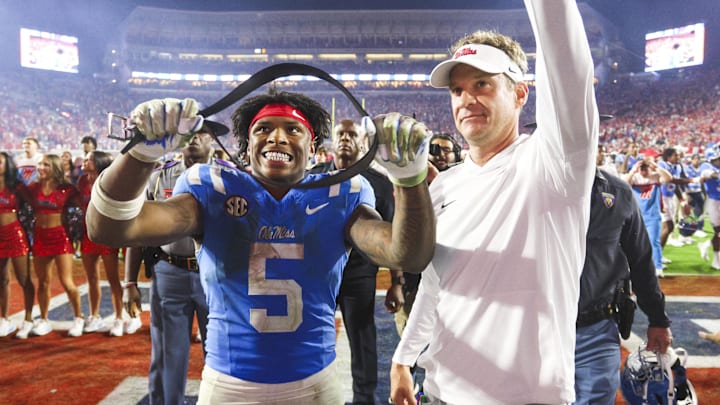 Nov 15, 2025; Oxford, Mississippi, USA; Mississippi Rebels running back Kewan Lacy (5) and head coach Lane Kiffin react after defeating the Florida Gators at Vaught-Hemingway Stadium. Mandatory Credit: Petre Thomas-Imagn Images Nov 15, 2025; Oxford, Mississippi, USA; Mississippi Rebels running back Kewan Lacy (5) and head coach Lane Kiffin react after defeating the Florida Gators at Vaught-Hemingway Stadium. Mandatory Credit: Petre Thomas-Imagn Images