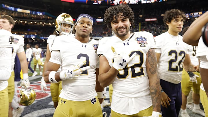 Jan 2, 2025; New Orleans, LA, USA; Notre Dame Fighting Irish safety Rod Heard II (2) and Fighting Irish cornerback Isaiah Dunn (32) celebrates on the field after defeating the Georgia Bulldogs at Caesars Superdome. Mandatory Credit: Amber Searls-Imagn Images Jan 2, 2025; New Orleans, LA, USA; Notre Dame Fighting Irish safety Rod Heard II (2) and Fighting Irish cornerback Isaiah Dunn (32) celebrates on the field after defeating the Georgia Bulldogs at Caesars Superdome. Mandatory Credit: Amber Searls-Imagn Images