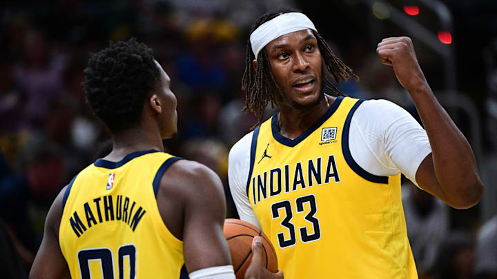 Oct 27, 2024; Indianapolis, Indiana, USA: Indiana Pacers center Myles Turner (33) talks with guard Bennedict Mathurin (00) during the second half of the game against the Philadelphia 76ers at Gainbridge Fieldhouse. Mandatory Credit: Marc Lebryk-Imagn Images Oct 27, 2024; Indianapolis, Indiana, USA: Indiana Pacers center Myles Turner (33) talks with guard Bennedict Mathurin (00) during the second half of the game against the Philadelphia 76ers at Gainbridge Fieldhouse. Mandatory Credit: Marc Lebryk-Imagn Images