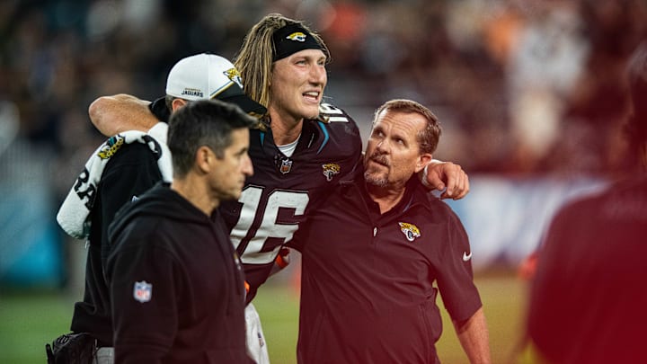 Dec 4, 2023; Jacksonville, Florida, USA; Jacksonville Jaguars quarterback Trevor Lawrence (16) walks off the field with an apparent injury in the fourth quarter against the Cincinnati Bengals at EverBank Stadium. Mandatory Credit: Jeremy Reper-Imagn Images