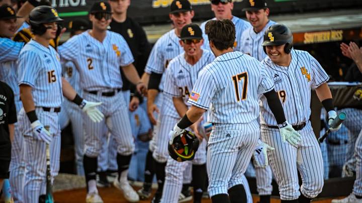 Kyle Morrison being greeted by his Southern Miss teammates outside of the dugout at Pete Taylor Park during the 2026 season. Kyle Morrison being greeted by his Southern Miss teammates outside of the dugout at Pete Taylor Park during the 2026 season.
