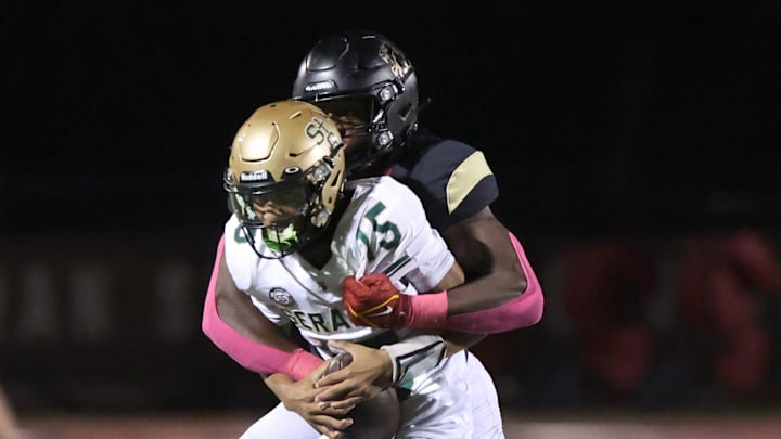 Oaks Christian's Hayden Lowe brings down St. Bonaventure's quarterback Jaxson Carper during the second quarter of Oaks Christian's 35-0 Marmonte League win over visiting St. Bonaventure Friday at Redell Field.