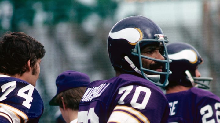 Jim Marshall looks on during a game against the Dolphins in 1976.
