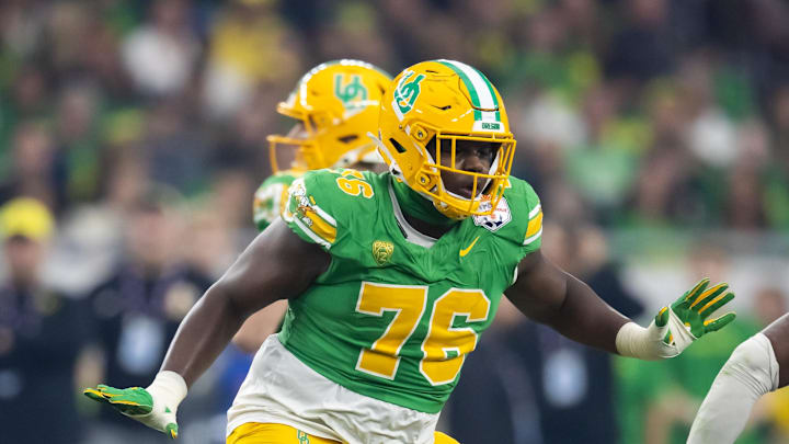 Jan 1, 2024; Glendale, AZ, USA; Oregon Ducks offensive lineman Josh Conerly Jr. (76) against the Liberty Flames during the 2024 Fiesta Bowl at State Farm Stadium. Mandatory Credit: Mark J. Rebilas-Imagn Images Jan 1, 2024; Glendale, AZ, USA; Oregon Ducks offensive lineman Josh Conerly Jr. (76) against the Liberty Flames during the 2024 Fiesta Bowl at State Farm Stadium. Mandatory Credit: Mark J. Rebilas-Imagn Images