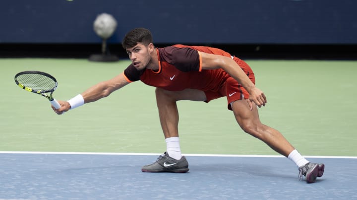 Carlos Alcaraz goes down on the court at the US Open. Carlos Alcaraz goes down on the court at the US Open.