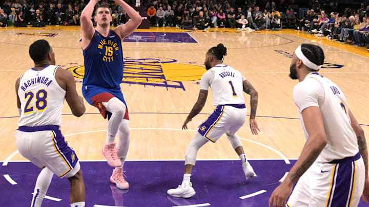 Mar 2, 2024; Los Angeles, California, USA; Denver Nuggets center Nikola Jokic (15) shoots over Los Angeles Lakers forward Rui Hachimura (28), guard D'Angelo Russell (1) and forward Anthony Davis (3) in the second half at Crypto.com Arena. Mandatory Credit: Jayne Kamin-Oncea-Imagn Images Mar 2, 2024; Los Angeles, California, USA; Denver Nuggets center Nikola Jokic (15) shoots over Los Angeles Lakers forward Rui Hachimura (28), guard D'Angelo Russell (1) and forward Anthony Davis (3) in the second half at Crypto.com Arena. Mandatory Credit: Jayne Kamin-Oncea-Imagn Images