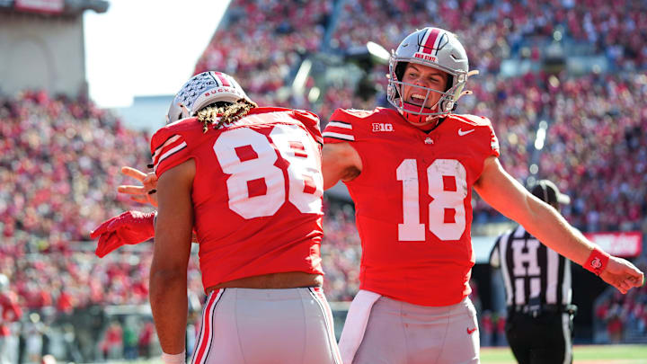 Ohio State Buckeyes quarterback Will Howard (18) celebrates with tight end Gee Scott Jr. (88) after Scott scored a touchdown in the first half at Ohio Stadium on Saturday, Nov. 9, 2024 in Columbus, Ohio.