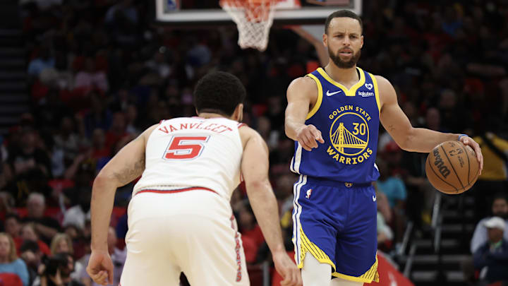 Golden State Warriors guard Stephen Curry (30) dribbles against Houston Rockets guard Fred VanVleet (5) in the second quarter at Toyota Center. Mandatory Credit: Thomas Shea-Imagn Images Golden State Warriors guard Stephen Curry (30) dribbles against Houston Rockets guard Fred VanVleet (5) in the second quarter at Toyota Center. Mandatory Credit: Thomas Shea-Imagn Images